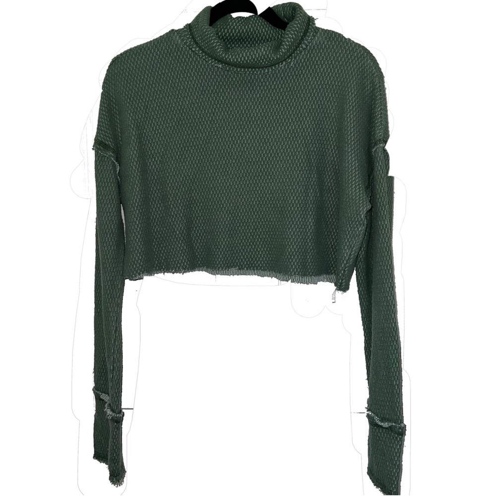 out front under green cropped turtleneck